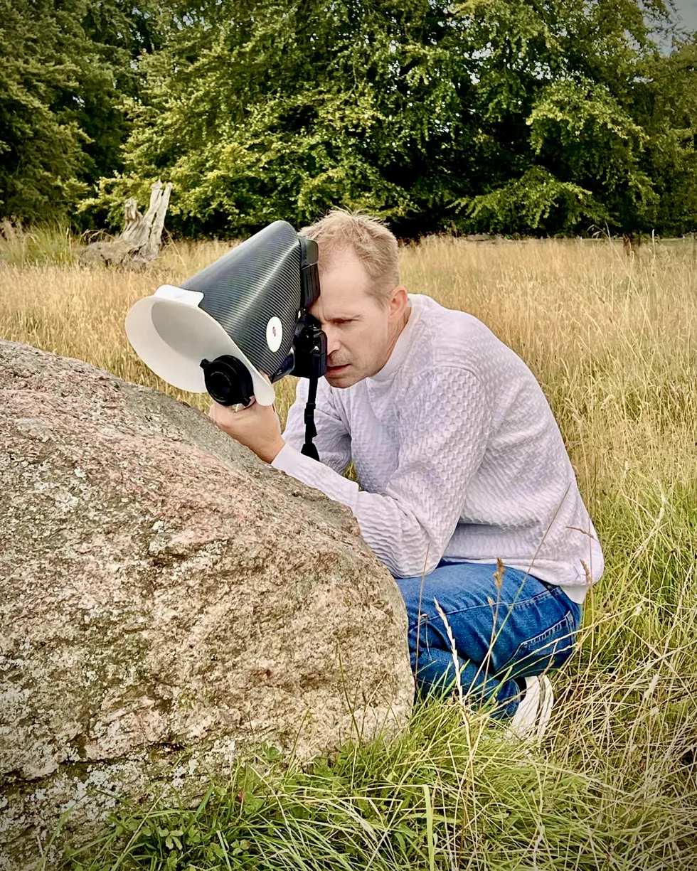 Bo Nexoe photographing in the field